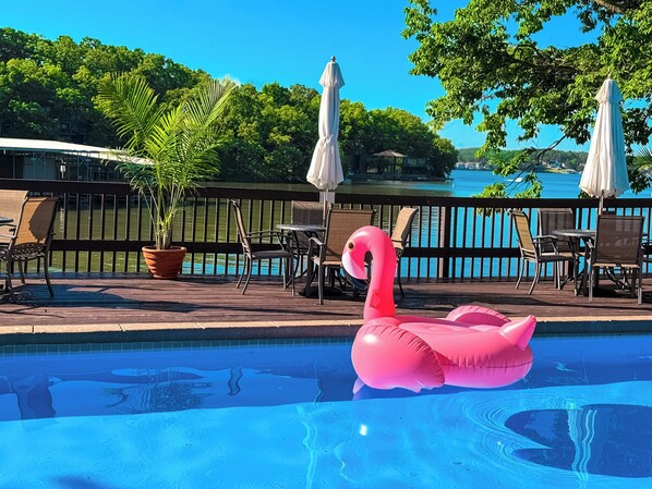 Soak up the sun at this stunning lakefront pool in Treetop Village, located in the iconic Four Seasons community at Lake of the Ozarks. Surrounded by trees and overlooking the sparkling lake, this serene pool area is the perfect place to unwind, swim, and take in the breathtaking views. Guests staying in Treetop Village enjoy exclusive access to this scenic pool, just steps fro...
