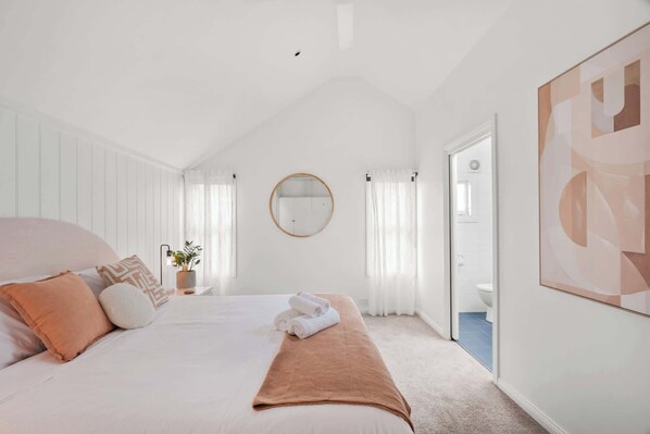 Spacious king bedroom complete with a built-in cabinet and a private ensuite bathroom—offering comfort, storage, and convenience all in one.