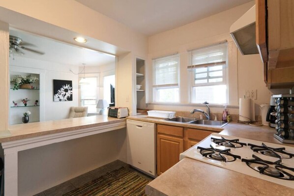 Kitchen - Includes dishwasher, stove, over, toaster, coffee maker, microwave