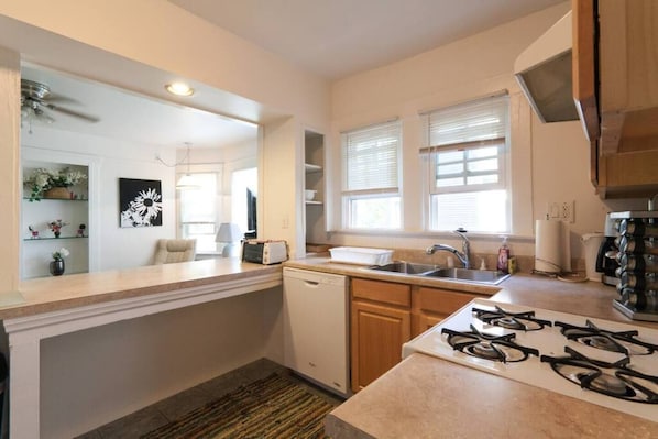 Kitchen - Includes dishwasher, stove, over, toaster, coffee maker, microwave