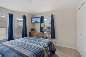 Rest easy in our cozy queen bedroom! Catch up on your favorite shows on the flat-screen TV after a fun-filled day exploring North Wildwood. Sweet dreams await!
