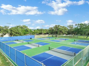 Challenge company to a fun game of pickleball or tennis.