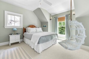Swing into relaxation in this comfort bedroom with a playful twist.