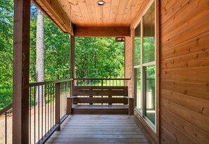 Start your day with a cup of coffee or wind down at dusk on this peaceful back deck with nature views all around.