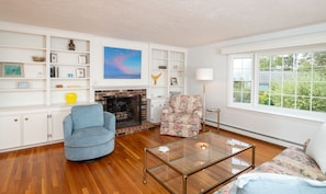 Bright sitting area with coastal décor—gather here for games, books, or evening chats.