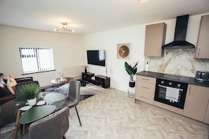 Spacious open-plan kitchen and living area with modern layout