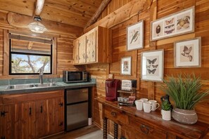 Enjoy lake views from every window while prepping your morning coffee. Kitchenette includes Keurig, microwave, and all the essentials to start your day.