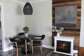 Dining nook with seating for 3. 
High chair available in garage.

Electric fireplace for cozy ambiance. Can run with or without heat on those colder days.