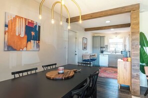 Open dining to living room & kitchen.
Pull up a chair for a group dinner with seating for 6 plus 2 at the cocktail table in the kitchen for a total of 8. Highchair available for littles.