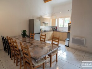 Large air-conditioned living room opening onto the fully equipped kitchen