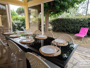 Outdoor area with large veranda and gas barbecue