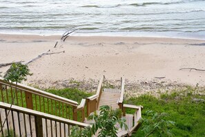 Stairs down to private, sandy beach
