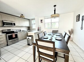 Kitchen and dining rom are open to each other.