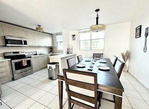 Kitchen and dining rom are open to each other.