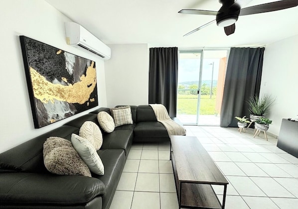 Spacious living room, leads to the patio.