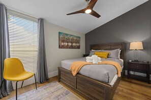 Primary Bedroom with a king size bed and it's own smart television. 