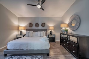 Primary Bedroom with King Size bed with it's own smart television