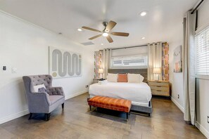 Large Primary Bedroom with a king size bed, smart television, dresser and attached bathroom.  Also, a private washer & dryer for the primary bedroom