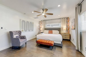 Large Primary Bedroom with a king size bed, smart television, dresser and attached bathroom. Also, a private washer & dryer for the primary bedroom