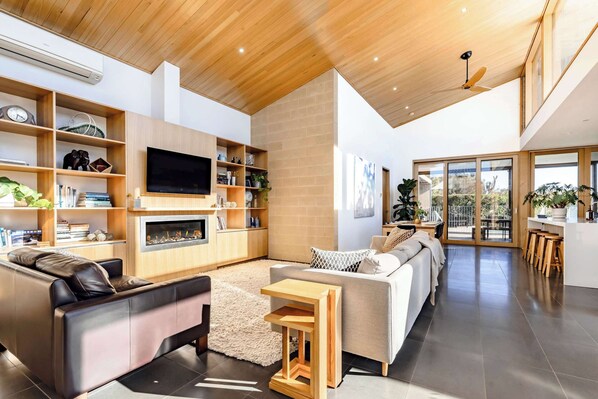 sunlight streams into the living area during the day and is warm and cosy at night with the gas fireplace