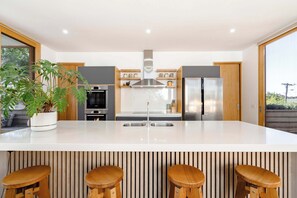 a fully equipped kitchen with butlers pantry