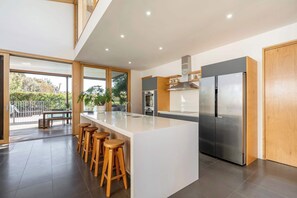 open the doors and the outdoor deck flows into another living space