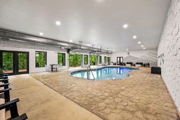Spacious indoor pool with lounge area.