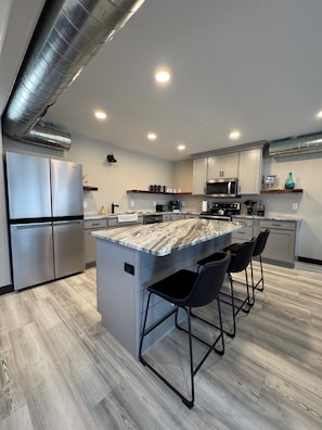 Downstairs kitchen with bar countertop