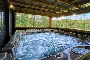 Hot Tub Haven: Unwind in the bubbling waters while surrounded by serene Tennessee vistas!