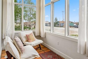 As you step into the front door, bask in the glow of warm and ever bright Sun Room!