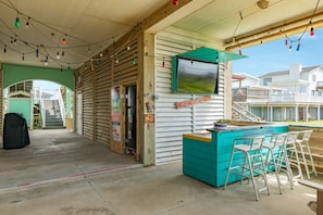 Downstairs bar, refrigerator, TV
