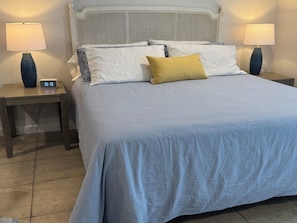 New King mattress w/side tables and lamps. Clock with Qi charging and Bluetooth.