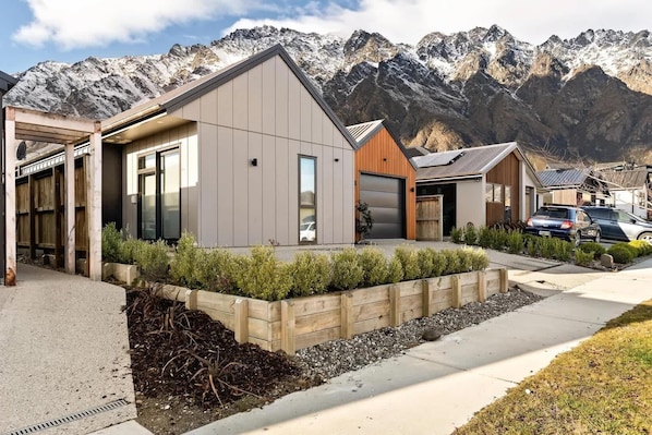 Sleek alpine-style facade with modern architecture and mountain views