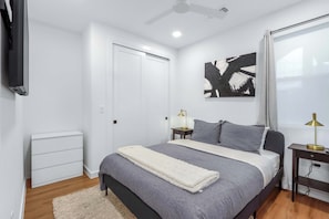 A plush queen bed, smart TV, & ensuite await in the bedroom retreat