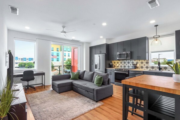 Curl up in the chic living room & stream your favorites on the smart TV