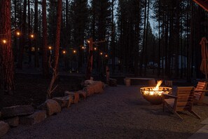 Spacious back yard with outdoor seating, fire pit, and hot tub 