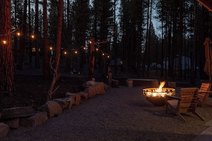 Spacious back yard with outdoor seating, fire pit, and hot tub