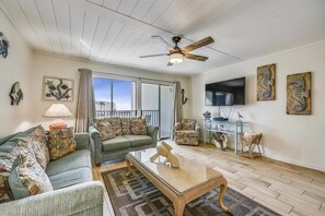 Living room with sleeper sofa with balcony entrance