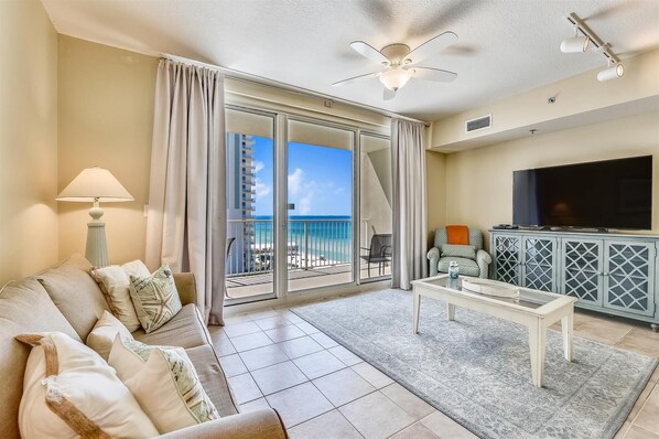 Living room with sleeper sofa and balcony access