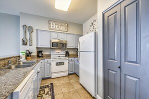 Tiled kitchen with custom built cabinets