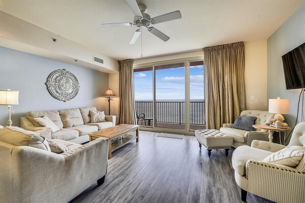 Living room with sleeper sofa and entrance onto the balcony