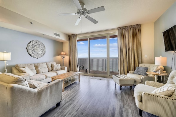Living room with sleeper sofa and entrance onto the balcony