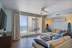 Living room with access to balcony and westward view of the Gulf!