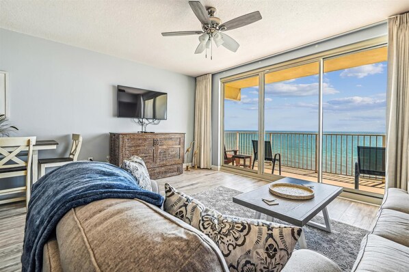 Living area with Murphy bed (under tv) and lots of natural light