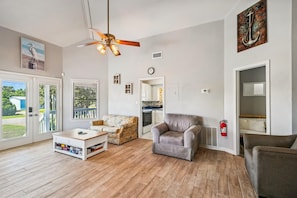 Living room Area leads into kitchen and Second Bedroom with Bunks and futon