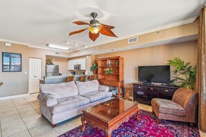 Living room with couch and love seat and chair/TV