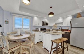 Dining table for 4
bar seating
full kitchen