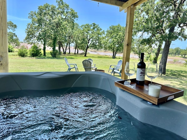Relax in the hot tub with a glass of wine and the breathtaking view of Texoma lake