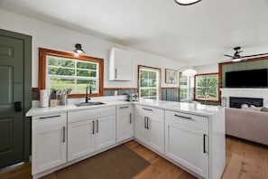 Fully equipped kitchen with modern appliances, perfect for home-cooked meals during your stay