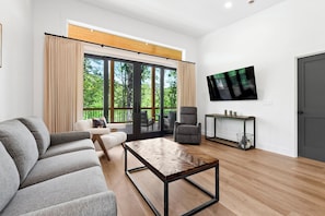 Open-concept living space with dining for 6, cozy seating, and a Smart TV for streaming